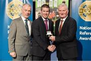8 November 2014; Referee Padraig Hughes, from Armagh, is presented with his Senior Club Football 2013 referees' medal by Pat McEnaney, Chairman of National Referee Committee, left, and Frank Burke, Vice-President of the GAA. 2014 National Referees' Awards Banquet, Croke Park, Dublin. Picture credit: Barry Cregg / SPORTSFILE