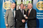 8 November 2014; Referee Sean Cleere, from Kilkenny, is presented with his Christy Ring Cup 2014 referees' medal by Pat McEnaney, Chairman of National Referee Committee, left, and Frank Burke, Vice-President of the GAA. 2014 National Referees' Awards Banquet, Croke Park, Dublin. Picture credit: Barry Cregg / SPORTSFILE