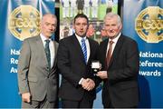 8 November 2014; Referee Fergal Horgan, from Tipperary, is presented with his Minor Hurling 2014 referees' medal by Pat McEnaney, Chairman of National Referee Committee, left, and Frank Burke, Vice-President of GAA. 2014 National Referees' Awards Banquet, Croke Park, Dublin. Picture credit: Barry Cregg / SPORTSFILE