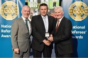 8 November 2014; Referee Brian Gavin, from Offaly, is presented with his Senior Hurling Replay 2014 referees' medal by Pat McEnaney, Chairman of National Referee Committee, left, and Frank Burke, Vice-President of the GAA. 2014 National Referees' Awards Banquet, Croke Park, Dublin. Picture credit: Barry Cregg / SPORTSFILE