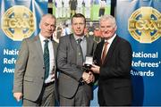 8 November 2014; Referee Joe McQuillan, from Cavan, is presented with his Senior Football 2013 referees' medal by Pat McEnaney, Chairman of National Referee Committee, left, and Frank Burke, Vice-President of the GAA. 2014 National Referees' Awards Banquet, Croke Park, Dublin. Picture credit: Barry Cregg / SPORTSFILE