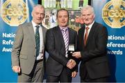 8 November 2014; Referee Eddie Kinsella, from Laois, is presented with his Senior Football 2014 referees' medal by Pat McEnaney, Chairman of National Referee Committee, left, and Frank Burke, Vice-President of the GAA. 2014 National Referees' Awards Banquet, Croke Park, Dublin. Picture credit: Barry Cregg / SPORTSFILE