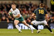 8 November 2014; Ian Madigan, Ireland, in action against Coenie Oosthuizen, South Africa. Guinness Series, Ireland v South Africa. Aviva Stadium, Lansdowne Road, Dublin. Picture credit: Ramsey Cardy / SPORTSFILE