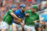 16 June 2007; Eoin Kelly, Tipperary, in action against Damien Reale, left, and Seamus Hickey, Limerick. Guinness Munster Senior Hurling Championship Semi-Final Replay, Limerick v Tipperary, Semple Stadium, Thurles, Co. Tipperary. Picture credit: Pat Murphy / SPORTSFILE