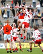 17 June 2007; Stephen Sheridan, Armagh, wins possession ahead of Peter Hughes, Tyrone. ESB Ulster Minor Football Championship Semi-Final, Tyrone v Armagh, St Tighearnach's Park, Clones, Co Monaghan. Photo by Sportsfile