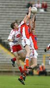 17 June 2007; Mark McKenna, Tyrone, in action against Stephen Sheridan and Anthony McCann, Armagh. ESB Ulster Minor Football Championship Semi-Final, Tyrone v Armagh, St Tighearnach's Park, Clones, Co Monaghan. Picture credit: Oliver McVeigh / SPORTSFILE