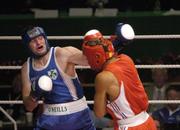 19 June 2006: Ireland’s John Sweeney, left, in action against John-Michael M’bumba, France. 5th European Union Boxing Championships, Heavy Weight 91kg Premliminary Round, John Sweeney, Ireland v John-Michael M’bumba, France, National Stadium, Dublin. Picture credit: Ray Lohan / SPORTSFILE