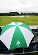 24 June 2007; Supporters take shelter awaiting the start of play. One Day Cricket International, Ireland v South Africa, Stormont, Belfast, Co. Antrim. Picture credit: Oliver McVeigh / SPORTSFILE