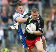 24 June 2007; Barry Gillis, Derry, in action against Rory Woods, Monaghan. Bank of Ireland Ulster Senior Football Championship Semi-Final, Derry v Monaghan, Casement Park, Belfast. Picture credit: Oliver McVeigh / SPORTSFILE