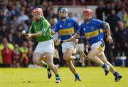 24 June 2007; Andrew O'Shaughnessy, Limerick, races clear of Hugh Maloney, centre, and Diarmuid Fitzgerald, Tipperary. Guinness Munster Senior Hurling Championship Semi-Final, 2nd Replay, Limerick v Tipperary, Gaelic Grounds, Limerick. Picture credit: Brendan Moran / SPORTSFILE