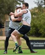 15 November 2014; Ireland's Sean Cavanagh is tackled by David Moran during International Rules squad training ahead of their International Rules Series warm up game against VFL All Stars on Sunday 16th. Ireland International Rules Squad Training, Sandringham VFL Ground, Melbourne, Victoria, Australia. Picture credit: Ray McManus / SPORTSFILE