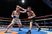 15 November 2014; Kofi Yates, left, exchanges punches with Oisin Fagan during their light-welterweight bout. Return of The Mack, 3Arena, Dublin. Picture credit: Ramsey Cardy / SPORTSFILE