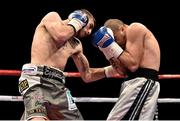 15 November 2014; Sam Eggington, left, exchanges punches with Sebastien Allais during their welterweight bout. Return of The Mack, 3Arena, Dublin. Picture credit: Ramsey Cardy / SPORTSFILE