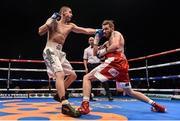 15 November 2014; Patrick Hyland, right, exchanges punches with Oskar Fiko during their featherweight bout. Return of The Mack, 3Arena, Dublin. Picture credit: Ramsey Cardy / SPORTSFILE