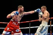 15 November 2014; Patrick Hyland, left, exchanges punches with Oskar Fiko during their featherweight bout. Return of The Mack, 3Arena, Dublin. Picture credit: Ramsey Cardy / SPORTSFILE