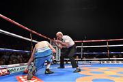 15 November 2014; Referee Micky Vann counts out Anthony Fitzgerald during the first round of his  middleweight bout against Gary 'Spike' O'Sullivan. Return of The Mack, 3Arena, Dublin.  Picture credit: Ramsey Cardy / SPORTSFILE