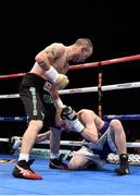 15 November 2014; John Joe Nevin, left, knocks down Jack Heath in the first round of their featherweight bout. Return of The Mack, 3Arena, Dublin. Picture credit: Ramsey Cardy / SPORTSFILE