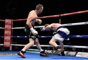 15 November 2014; John Joe Nevin, left, knocks down Jack Heath in the first round of their featherweight bout. Return of The Mack, 3Arena, Dublin. Picture credit: Ramsey Cardy / SPORTSFILE