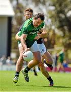 16 November 2014; The Ireland captain Michael Murphy is tackled by the VFL Selection captain Ben Jolley. VFL Selection v Ireland - International Rules warm-up match, Sandringham VFL Ground, Trevor Barker Beach Oval, Melbourne, Victoria, Australia. Picture credit: Ray McManus / SPORTSFILE