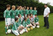 25 June 2006; Former Republic of Ireland star and 'Godfather' to this year's Irish team, Denis Irwin, speaking to the talented young Cherry Orchard team who will travel to Lyon to represent Ireland in less than a week's time at the Danone Nations Cup World Final. Irwin took the young team under his wing one last time to pass on his expertise and vast knowledge of International soccer. AUL Complex, Clonshaugh, Dublin. Picture credit: Brendan Moran / SPORTSFILE