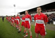 24 June 2007; Derry's Enda Muldoon, right, along with his team -mates stand for a minutes silence for his former manager Eamon Coleman. Bank of Ireland Ulster Senior Football Championship Semi-Final, Derry v Monaghan, Casement Park, Belfast, Co. Antrim. Picture credit: Oliver McVeigh / SPORTSFILE