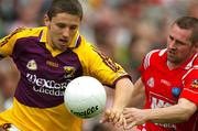 17 June 2007; Ciaran Lyng, Wexford, in action against Alan Page, Louth. Bank of Ireland Leinster Senior Football Championship Quarter-Final, Louth v Wexford, Croke Park, Dublin. Picture credit: Ray McManus / SPORTSFILE