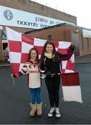 16 November 2014; Slaughtneil supporters Caitlain and Caoimhe Kearney fly their colours ahead of the game. AIB Ulster GAA Football Senior Club Championship Semi-Final, Slaughtneil v Clontibret O'Neills, Healy Park, Omagh, Co. Tyrone. Picture credit: Oliver McVeigh / SPORTSFILE