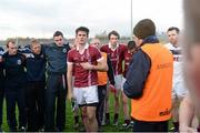 16 November 2014; Chrissy McKaigue, Slaughtneil, centre, due to flight out tomorrow morning to Austrailia to join up with the Ireland International rules team  watches on as Mickey Moran, Team manager speaks during a team huddle after victory. AIB Ulster GAA Football Senior Club Championship Semi-Final, Slaughtneil v Clontibret O'Neills, Healy Park, Omagh, Co. Tyrone. Picture credit: Oliver McVeigh / SPORTSFILE