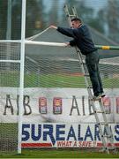 16 November 2014; Paul O'Sullivan, from Blennerville, Co. Kerry, removes the net from the goals after the game. AIB Munster GAA Football Senior Club Championship Semi-Final, Austin Stacks v Ballincollig, Austin Stack Park, Tralee, Co. Kerry. Picture credit: Diarmuid Greene / SPORTSFILE