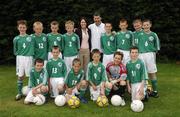 25 June 2006; Former Republic of Ireland star and 'Godfather' to this year's Irish team, Denis Irwin, met once again with the talented young Cherry Orchard team who will travel to Lyon to represent Ireland in less than a week's time at the Danone Nations Cup World Final. Irwin took the young team under his wing one last time to pass on his expertise and vast knowledge of International soccer. Pictured with the team are Denis and Deirdre O'Leary, Brand Manager, Danone. AUL Complex, Clonshaugh, Dublin. Picture credit: Brendan Moran / SPORTSFILE