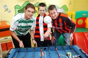 27 June 2007; Barry Ferguson, Shamrock Rovers, left, and Jason McGuinness, Bohemians, with Lorcan Cassidy, age 12, from Swords, on a visit to Temple Street Children's University Hospital, in advance of their eircom League of Ireland fixture in Tolka Park this coming friday. Temple Street, Dublin. Picture credit: Brian Lawless / SPORTSFILE