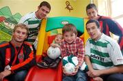 27 June 2007; John Paul Kelly, Bohemians, left, Barry Ferguson, Shamrock Rovers, Jason McGuinness, Bohemians, right, and Tadhg Purcell, Shamrock Rovers, second from right, with Shane Sweeney, left, age 4, from Mayo, a patient at the hospital, and visitor David Dunne, age 7, from Castlejordan, on a visit to Temple Street Children's University Hospital, in advance of their eircom League of Ireland fixture in Tolka Park this coming friday. Temple Street, Dublin. Picture credit: Brian Lawless / SPORTSFILE