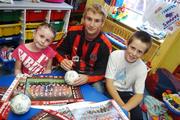27 June 2007; John Paul Kelly, Bohemians, signs autographs for Nicole Byrne, age 8, from Dublin, and Lorcan Cassidy, age 12, from Dublin, on a visit to Temple Street Children's University Hospital, in advance of their eircom League of Ireland fixture against Shamrock Rovers in Tolka Park this coming friday. Players from Shamrock Rovers were also visiting. Temple Street, Dublin. Picture credit: Brian Lawless / SPORTSFILE