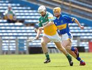 30 June 2007; Kevin Brady, Offaly, in action against Pa Bourke, Tipperary. Guinness All-Ireland Hurling Championship Qualifier, Group 1B, Round 1, Tipperary v Offaly, Semple Stadium, Thurles, Co. Tipperary. Photo by Sportsfile