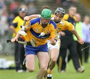 30 June 2007; Diarmuid McMahon, Clare, in action against Sean Delargy, Antrim. Guinness All-Ireland Hurling Championship Qualifier, Group 1A, Round 1, Antrim v Clare, Casement Park, Belfast, Co. Antrim. Picture credit: Oliver McVeigh / SPORTSFILE