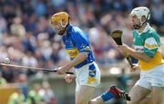 30 June 2007; Lar Corbett, Tipperary, in action against Kevin Brady, Offaly. Guinness All-Ireland Hurling Championship Qualifier, Group 1B, Round 1, Tipperary v Offaly, Semple Stadium, Thurles, Co. Tipperary. Photo by Sportsfile
