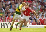 1 July 2007; Colm Cooper, Kerry, holds off the challenge of Kieran O'Connor, Cork. Bank of Ireland Munster Senior Football Championship Final, Kerry v Cork, Fitzgerald Stadium, Killarney, Co. Kerry. Picture credit: Brendan Moran / SPORTSFILE