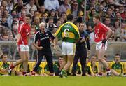 1 July 2007; Cork manager Billy Morgan and Kerry manager Pat O'Shea both question a decision by the referee. Bank of Ireland Munster Senior Football Championship Final, Kerry v Cork, Fitzgerald Stadium, Killarney, Co. Kerry. Picture credit: Brendan Moran / SPORTSFILE