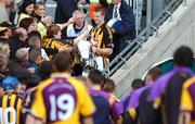 1 July 2007; Kilkenny captain Henry Shefflin holds the Leinster Senior Cup as Wexford players make their way to their dressing room. Guinness Leinster Senior Hurling Championship Final, Kilkenny v Wexford, Croke Park, Dublin. Picture credit: David Maher / SPORTSFILE