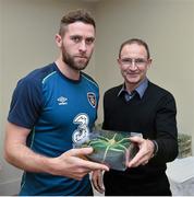 17 November 2014; Daryl Murphy is presented with his senior international cap by Republic of Ireland manager Martin O'Neill. Republic of Ireland Squad Caps Presentation, Portmarnock Hotel & Golf Links, Portmarnock, Co. Dublin Picture credit: David Maher / SPORTSFILE