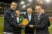 18 November 2014; John O'Shea is presented with his 100th cap by Republic of Ireland manager Martin O'Neill. International Friendly, Republic of Ireland v USA, Aviva Stadium, Lansdowne Road, Dublin.