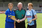 30 June 2007; Captains Anne McCluskey, Dublin, and Claire Grogan, Tipperary, shake hands in front of referee Ciaran Quigley. Gala All Ireland Senior Camogie Championship, O'Duffy Cup, Dublin v Tipperary, Parnell Park, Dublin. Picture credit: Ray McManus / SPORTSFILE