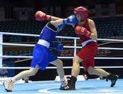 20 November 2014; Katie Taylor, Ireland, left, exchanges punches with Mira Potkonen, Finland, during their Women's Light 60kg last 16 bout. 2014 AIBA Elite Women's World Boxing Championships, Jeju, Korea. Photo by Sportsfile