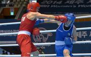 20 November 2014; Mira Potkonen, Finland, left, exchanges punches with Katie Taylor, Ireland, during their Women's Light 60kg last 16 bout. 2014 AIBA Elite Women's World Boxing Championships, Jeju, Korea. Photo by Sportsfile