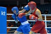 20 November 2014; Katie Taylor, Ireland, left, exchanges punches with Mira Potkonen, Finland, during their Women's Light 60kg last 16 bout. 2014 AIBA Elite Women's World Boxing Championships, Jeju, Korea. Photo by Sportsfile