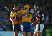 7 July 2007; Niall Gilligan, Clare, is congratulated by team-mates Declan O'Rourke, left, and Jonathan Clancy, 15, after scoring his side's second goal as Shane Kavanagh, Galway, looks on. Guinness All-Ireland Senior Hurling Championship Qualifier, Group 1A, Round 2, Clare v Galway, Cusack Park, Ennis, Co. Clare. Picture credit: Brendan Moran / SPORTSFILE