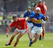 8 July 2007; Sean O'Brien, Tipperary, in action against Padraig Gould, Cork. ESB Munster Minor Hurling Championship Final, Cork v Tipperary, Semple Stadium, Thurles, Co. Tipperary. Photo by Sportsfile