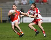 8 July 2007; Martin O'Rourke, Armagh, in action against Gerard O'Kane, Derry. Bank of Ireland All-Ireland Senior Football Championship Qualifier, Round 1, Armagh v Derry, St Tighearnach's Park, Clones, Co. Monaghan. Picture credit: Oliver McVeigh / SPORTSFILE