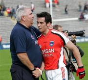 8 July 2007; Armagh manager, Joe Kernan, consoles his son Aaron Kernan at the end of the game. Bank of Ireland All-Ireland Senior Football Championship Qualifier, Round 1, Armagh v Derry, St Tighearnach's Park, Clones, Co. Monaghan. Picture credit: Oliver McVeigh / SPORTSFILE