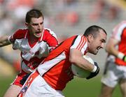 8 July 2007; Martin O'Rourke, Armagh, in action against Gerard O'Kane, Derry. Bank of Ireland All-Ireland Senior Football Championship Qualifier, Round 1, Armagh v Derry, St Tighearnach's Park, Clones, Co. Monaghan. Picture credit: Oliver McVeigh / SPORTSFILE